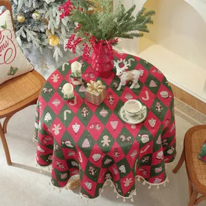 Detail of red and green Christmas tablecloth with tassels and nutcracker patterns