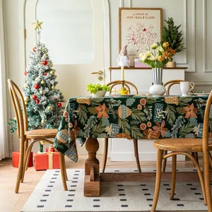 Close-up of luxury jacquard Christmas tablecloth with festive floral and pine patterns