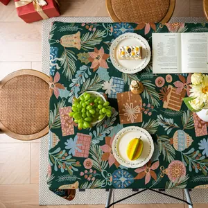 Close-up of thick Christmas tablecloth with jacquard weave and festive bell patterns