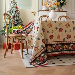 Thick jacquard Christmas tablecloth with red poinsettia and golden bells on beige fabric