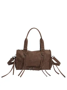 Vintage dark brown tote bag with boho tassels and metallic rivets for winter fashion