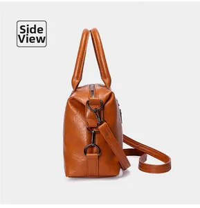 Seitenansicht der braunen PU-Leder-Handtasche mit D-Ring und verstellbarem Schultergurt