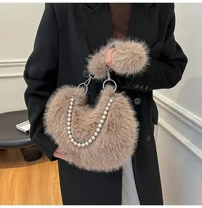 Detail of light coffee plush handbag featuring fluffy faux fur and elegant pearl chain strap
