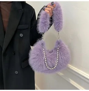 Close-up of fluffy lavender faux fur handbag with stylish silver pearl metal chain