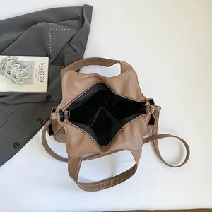 Brown litchi grain leather tote bag with spacious compartments and detachable strap