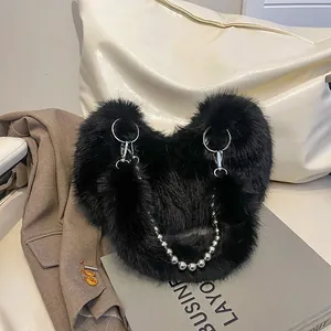 Faux fur handbag with large silver ring buckle and metallic bead chain strap