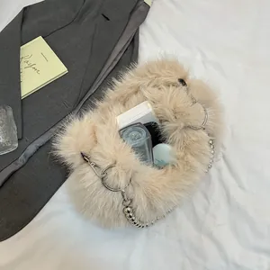 Faux fur handbag with silver pearl chain strap and soft beige texture for women