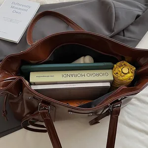 Brown vintage faux leather tote bag showing large capacity for laptop and daily essentials