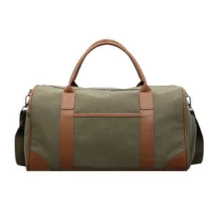 Retro Reisetasche aus dunkelgrünem Segeltuch mit braunen Ledergriffen und Schultergurt