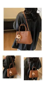 Brown litchi grain satchel with metallic plaque and plush charm shown from multiple angles