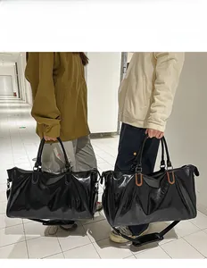 Waterproof PU leather travel duffel bag showing size comparison on male and female models