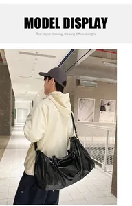 Model showing a large black waterproof PU leather travel bag with adjustable strap