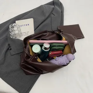 Deep brown large capacity faux leather tote bag with white stitching and accessories