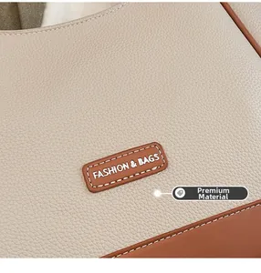 Détail du cuir grainé de qualité supérieure et du logo sur le sac fourre-tout chic