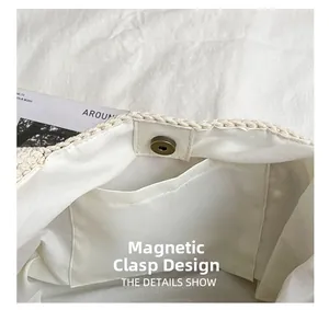 Detail of magnetic closure and woven interior lining on cream crochet bucket bag