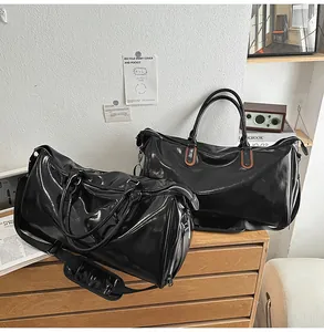 Close-up of glossy waterproof PU travel bags with wide straps and spacious compartments