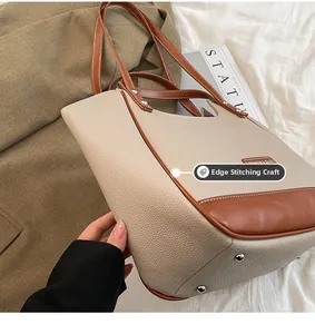 Détail du processus de bordure roulée et texture litchi du sac fourre-tout beige