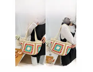 Detail of the multi-colored crochet tote bag showing hand-knitted floral patterns