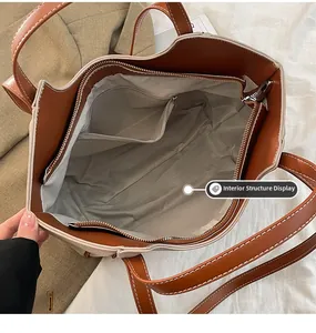 Vue détaillée de la structure interne spacieuse avec poche zippée dans un sac fourre-tout