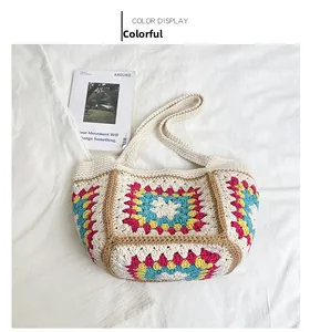 Detail of handmade crochet tote bag with colorful granny square patterns and woven strap