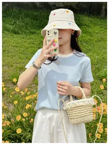 Straw bucket bag with white lace trim for summer beach vacation and fairy style