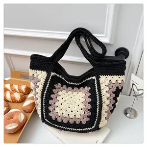 Detail of handmade crochet tote bag featuring vintage checkered grandmother square patterns