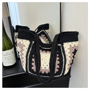 Knitted granny square tote bag with vintage crochet pattern in black and purple
