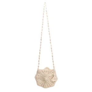 Handmade cream crochet star bag with pearl accent and tassels for beach vacation
