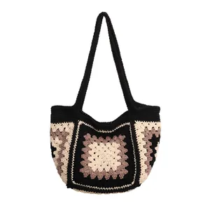 Handmade crochet knit tote bag with vintage granny square pattern and black top handles