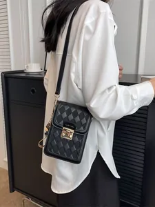 Chic black quilted crossbody phone bag for women with gold square metal lock and strap
