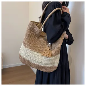 Spacious woven paper straw tote bag with tassel charm and tricolor horizontal stripes
