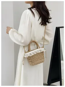Detailed macro of straw bucket bag with lace trim, pearl accents and drawstring closure