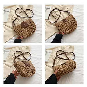 Detail of hollow woven straw bag with leather strap and contrasting inner lining pouch