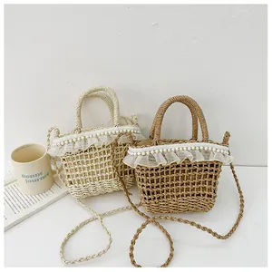 Detail of mini straw bucket bags with lace trim, pearls, and woven shoulder straps