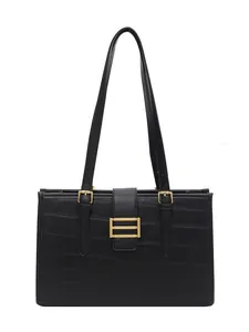 Large black faux crocodile leather tote bag with elegant gold metal buckle detail