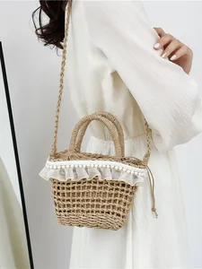 Woven straw bucket bag with lace ruffles and pearls for summer beach vacations