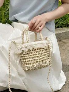 Handwoven straw bucket bag with white lace trim and pearls for summer beach vacations