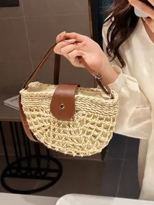 Beige woven straw shoulder bag with brown faux leather straps and silver buckle