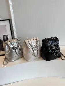 Y2K metallic silver and rhinestone mini backpack with chain strap and flap closure