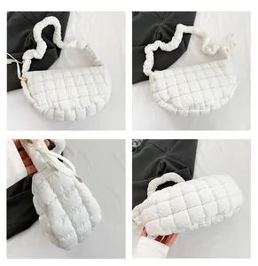 Multi-angle views of white quilted puffy shoulder bag with ruched handle and metal zipper