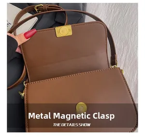 Detail view of the brown PU leather crossbody bag featuring a golden hardware magnetic buckle