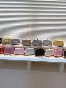 Sparkling rhinestone dinner clutch bags in various colors with round metal handles