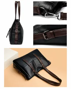 Detail der schwarzen Tote-Bag aus Leder mit dunkelbraunen Riemen und Metallbeschlägen