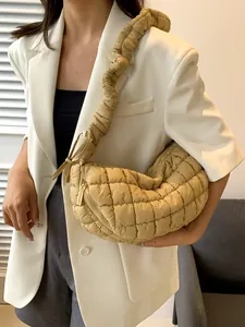 Quilted khaki crescent shoulder bag with ruched strap and stylish puffer texture