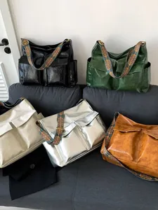 Five vintage large capacity tote bags in assorted colors with ethnic woven straps