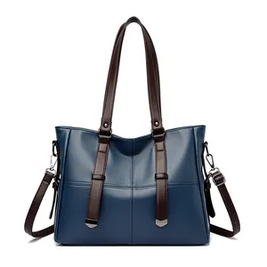 Sac à main bleu marine en similicuir avec anses contrastées et bandoulière réglable