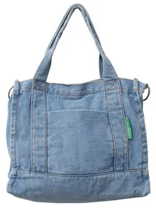 Minimalist light blue denim tote bag with front pocket and side metal D-rings