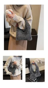 Detail view of sparkly silver knit texture and seamless handle on the elegant shoulder bag