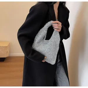 Close-up of sparkling silver sequin fabric and texture on stylish underarm tote bag