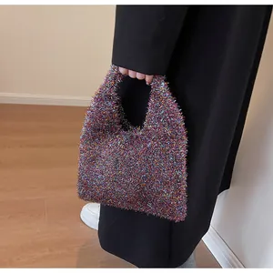 Close-up of a sparkling multi-color metallic tinsel mini tote bag with handle